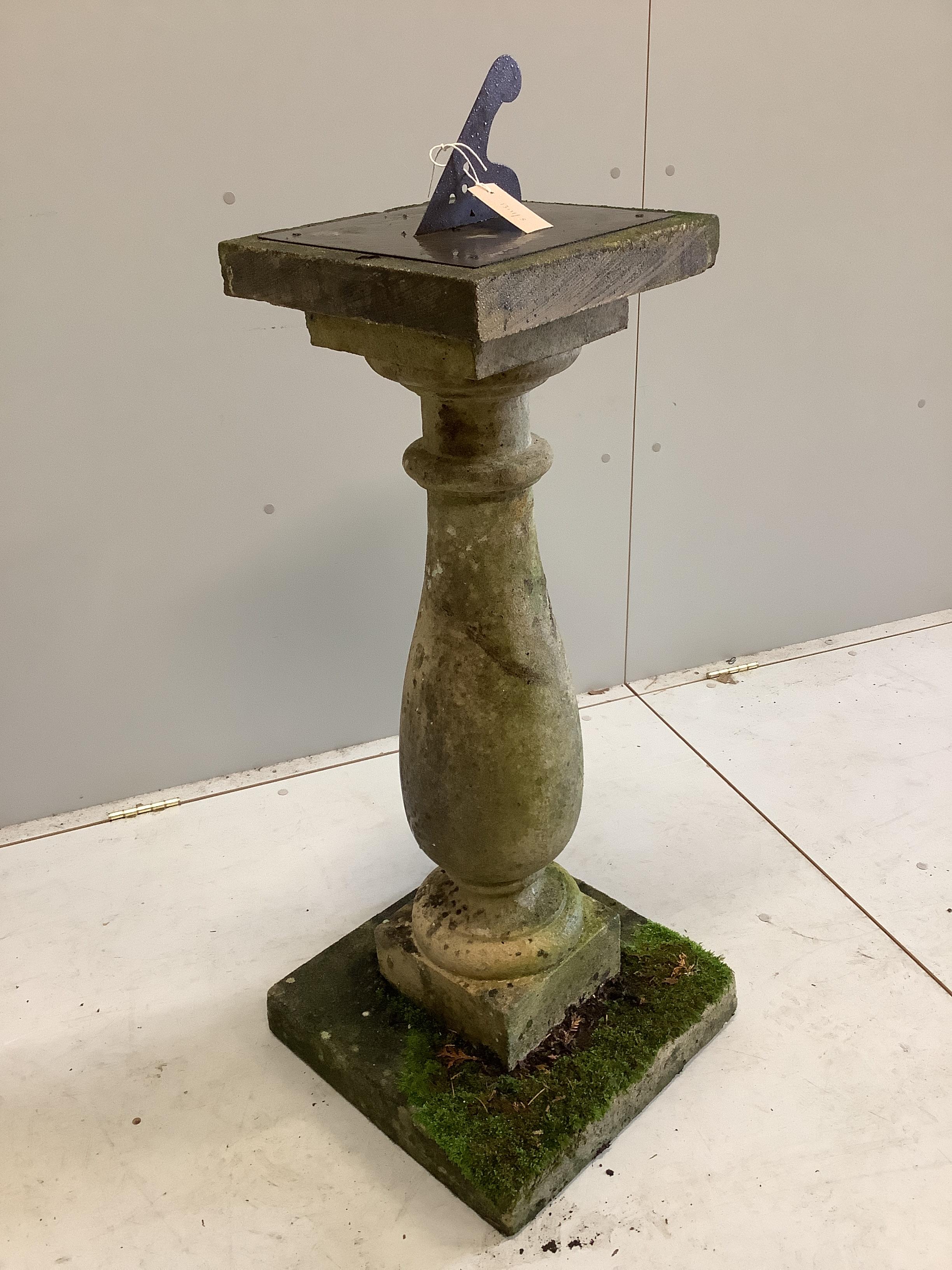 A reconstituted stone garden sundial with lead gnomon, width 30cm, height 106cm